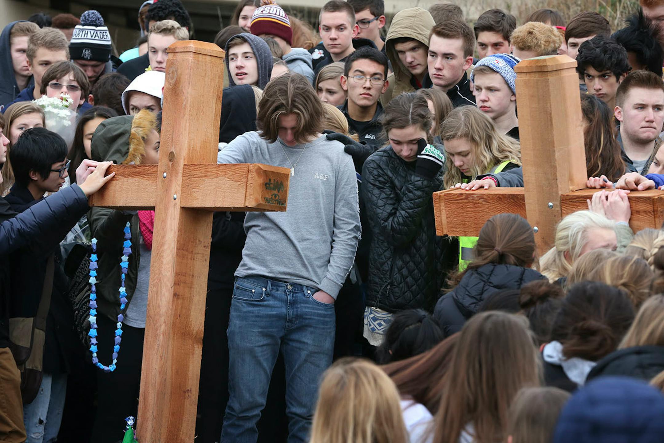 Students from Mounds View High school gathered at the crash scene along Hwy. 96 where they left memorials for two students that were killed in a crash December 05, 2016.
