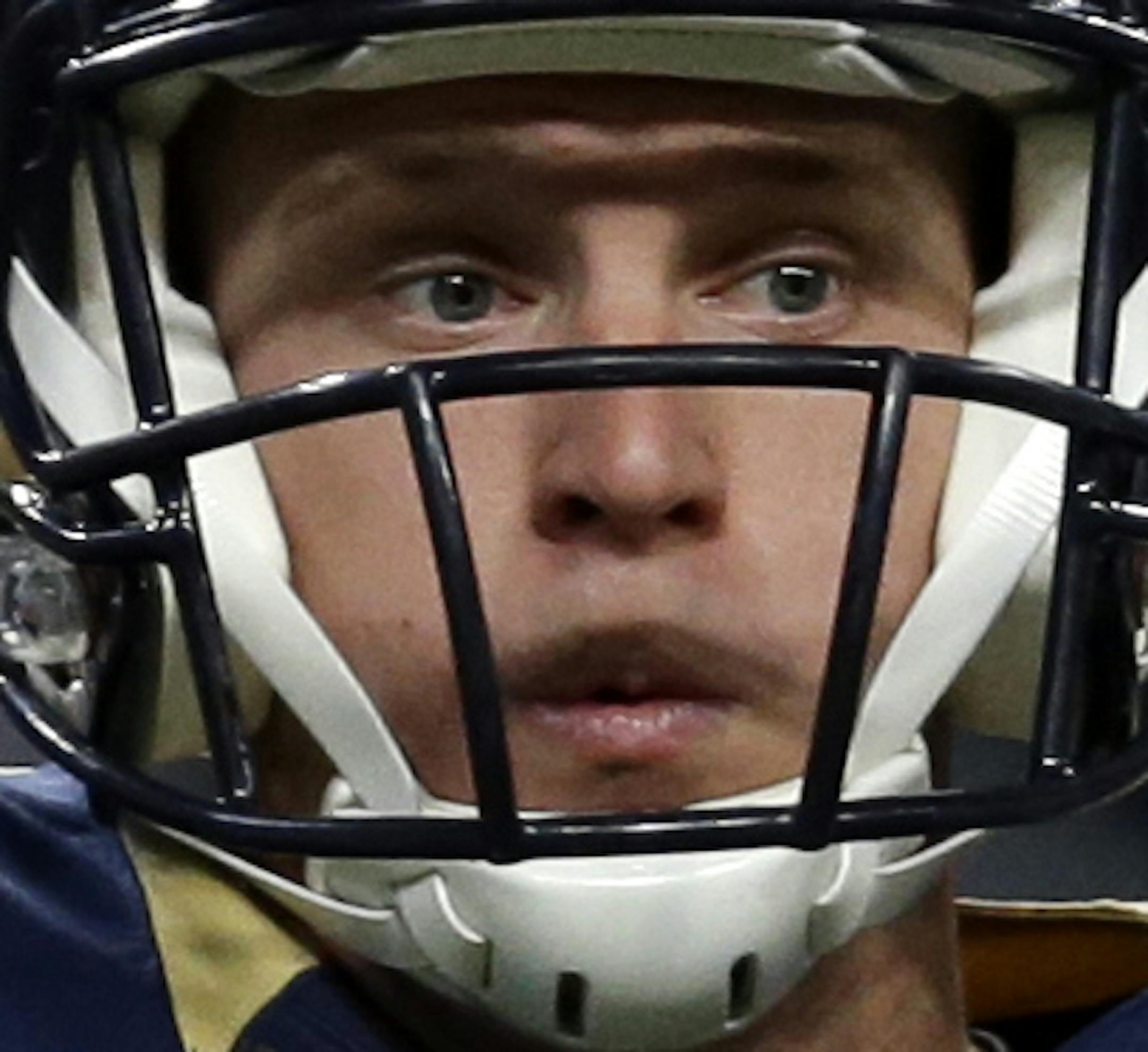 St. Louis Rams quarterback Austin Davis throws during the first quarter of an NFL football game against the Seattle Seahawks, Sunday, Oct. 19, 2014, in St. Louis. (AP Photo/Jeff Roberson)