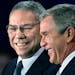 In this Dec. 16. 2000 file photo, President-elect Bush smiles as he introduces retired Gen. Colin Powell, left, as his nominee to be secretary of stat