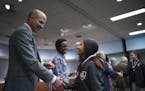 Joe Gothard Congratulated a member of the Central High School soccer team during the recognition portion of the board meeting.