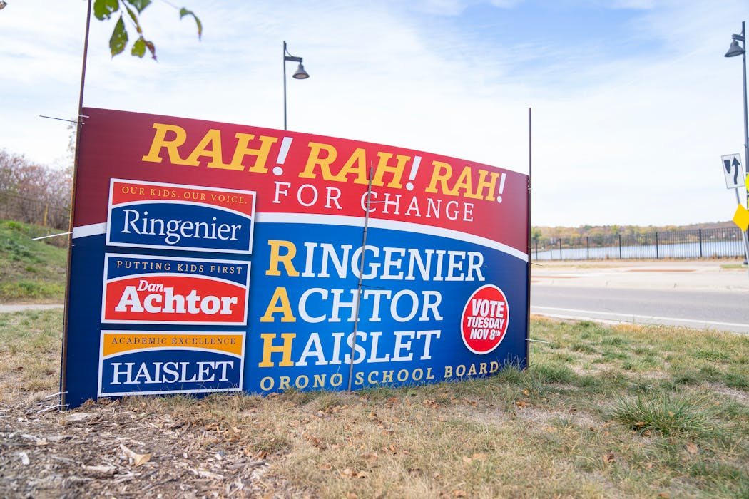 A lawn sign promoting three candidates for Orono School Board was displayed Thursday near a road in Long Lake.