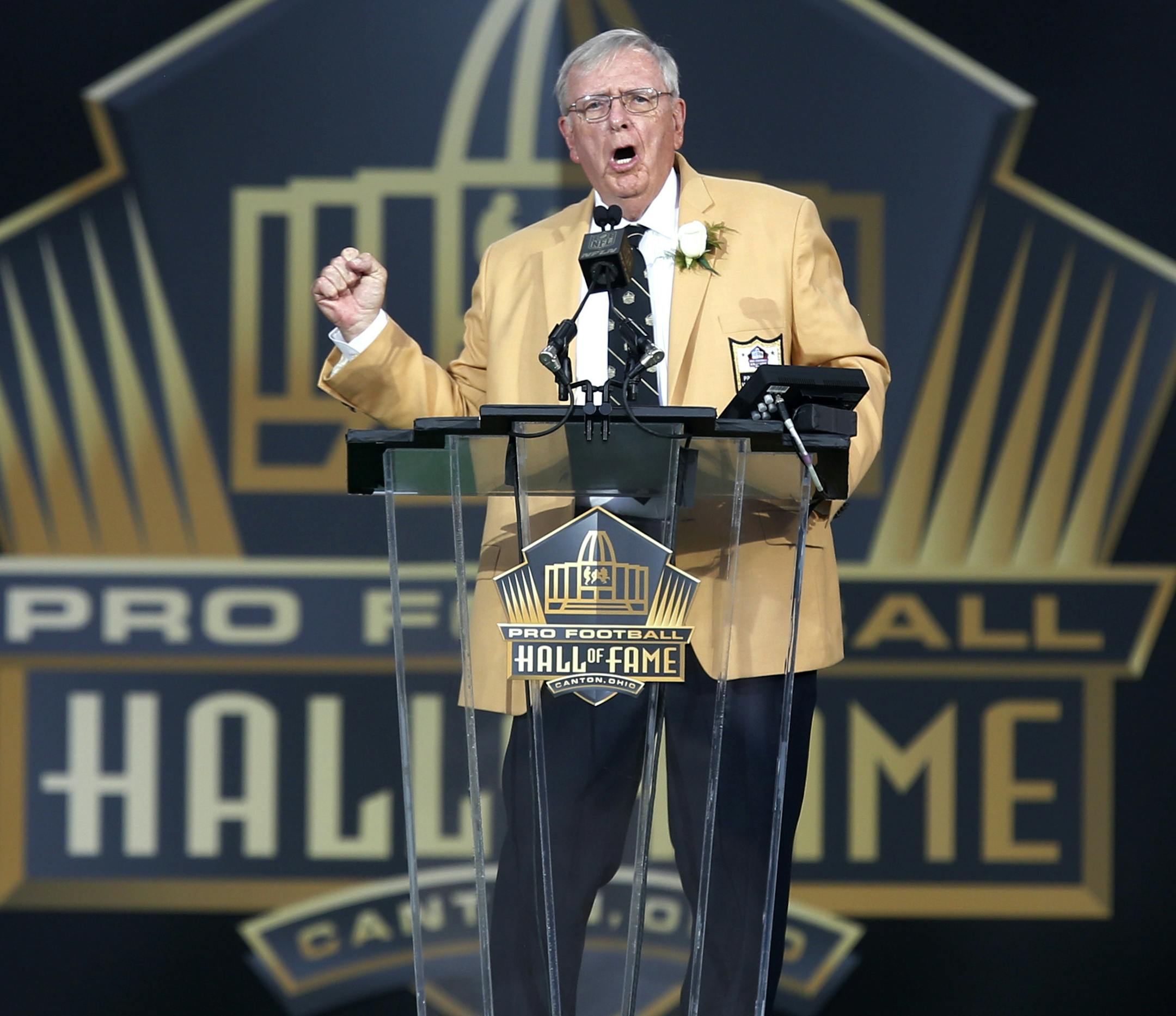 Ron Wolf gestures as he gives his speech during inductions to the Pro Football Hall of Fame on Saturday, Aug. 8, 2015, in Canton, Ohio. (AP Photo/Tom Puskar)
