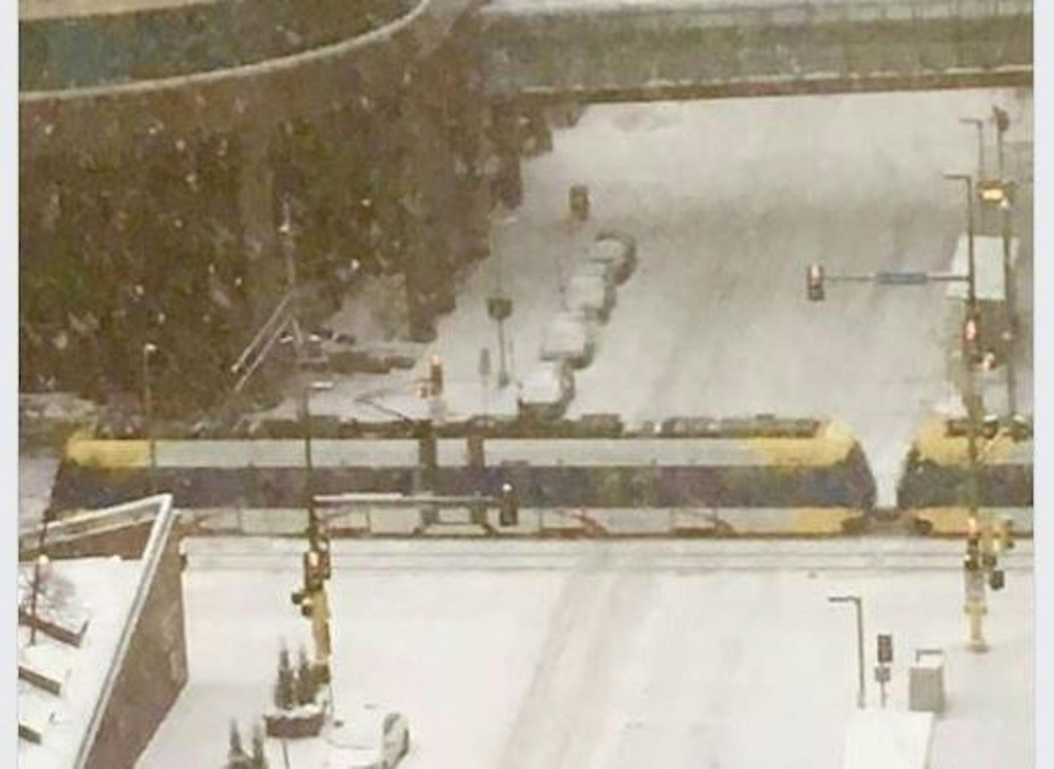 Light rail rolled by in downtown Minneapolis as the next round of snow moved in.
