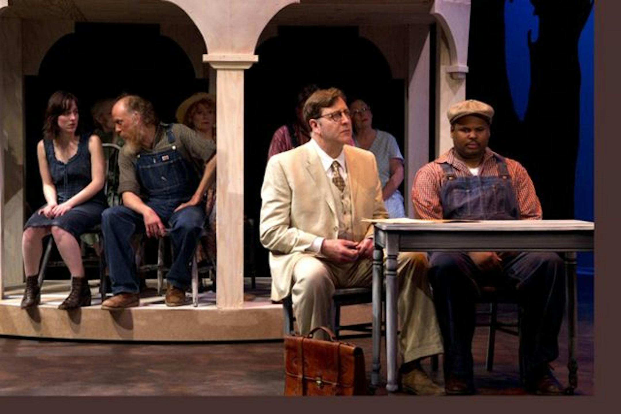 In the courtroom of "To Kill a Mockingbird," left to right: Mayella Ewell (Prentiss Standridge), Bob Ewell (Joel Raney), Atticus Finch (Fred Wagner) and Tom Robinson (Payton Woodson).