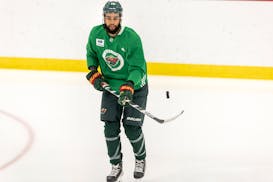 Wild forward Jordan Greenway is relegated to some drills and conditioning while he heals at training camp.