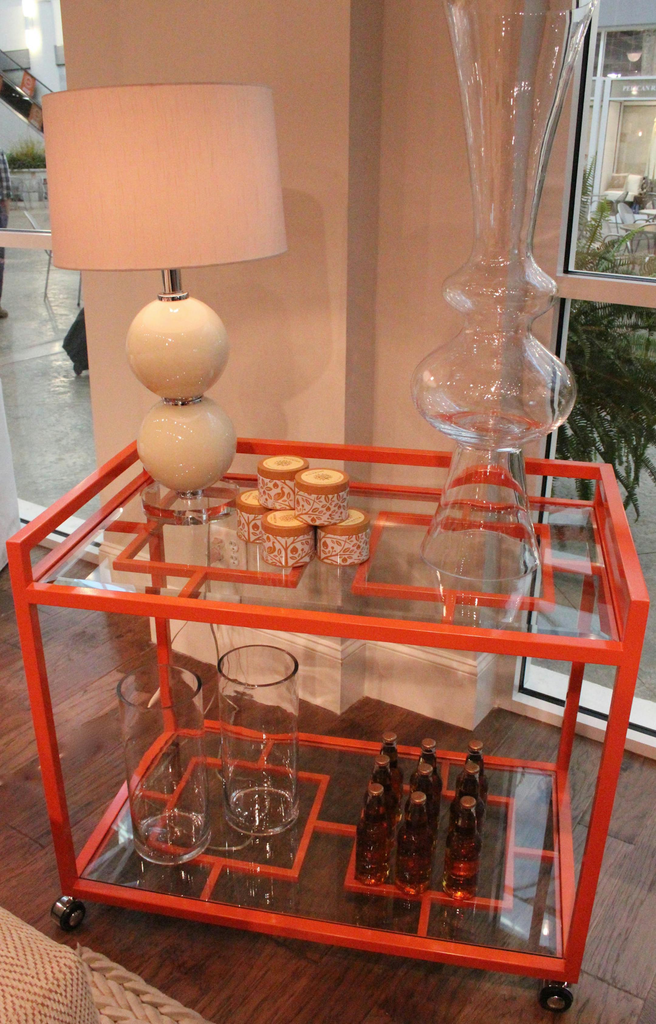 SH13G039HOMEBARS July 8, 2013 -- Rowe Furniture's orange lacquer bar cart. (SHNS photo by Patricia Sheridan/Pittsburgh Post-Gazette) (Newscom TagID: shnsphotos147090.jpg) [Photo via Newscom]