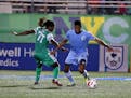New York Cosmos forward Lucky Mkosana (77) Minnesota United FC defenseman Damion Lowe (31) battle for a loose ball during the first half at James M. S