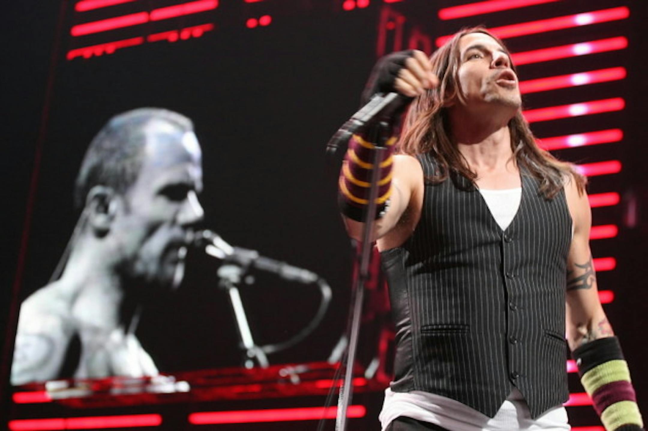 Flea and Anthony Kiedis had to delay some of their tour following the singer's foot surgery. / AP Photo, Fabian Bimmer