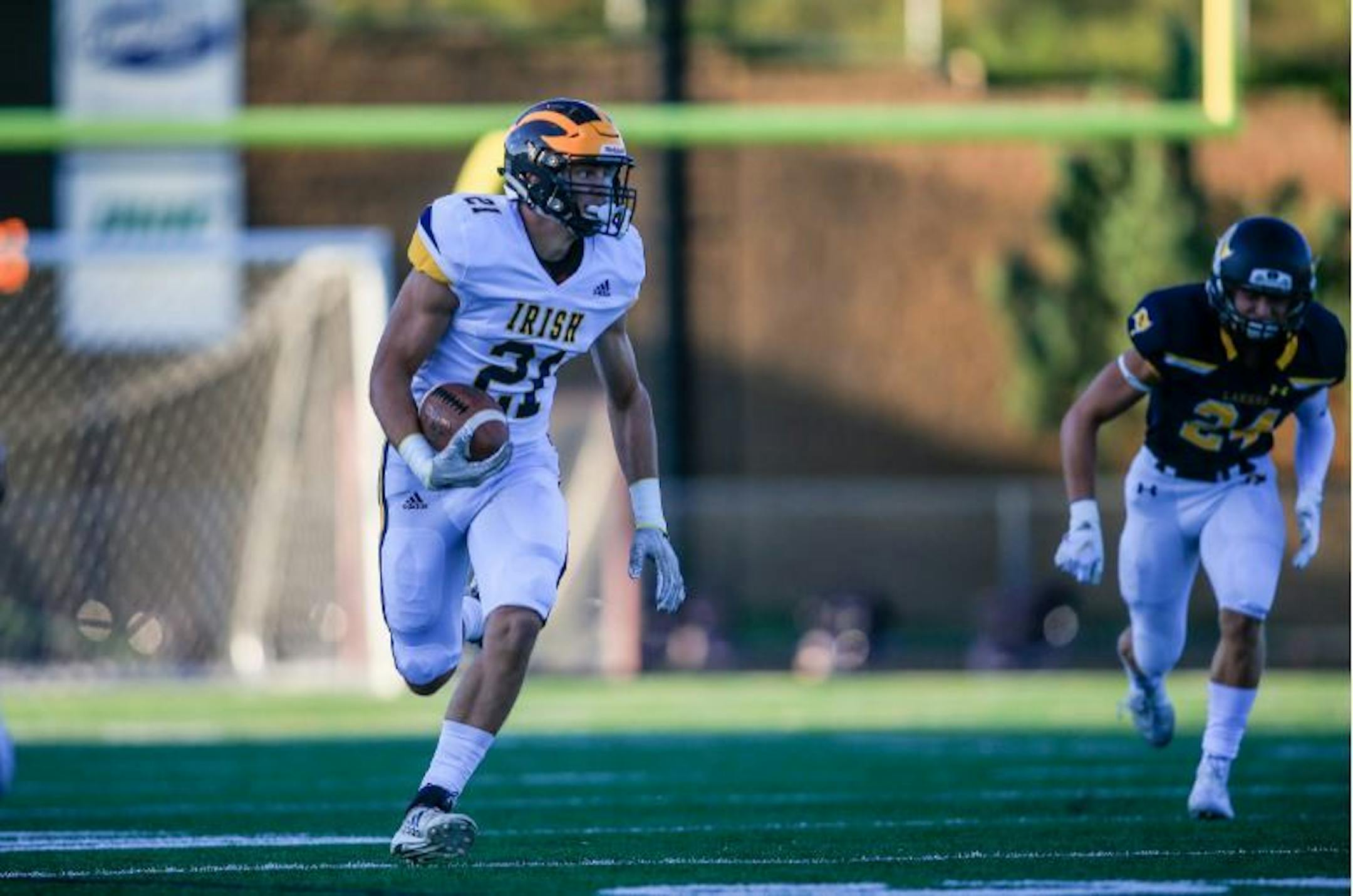 Rosemount receiver Jake Ratzlaff (21), who will play college hockey for the Gophers, teams with Gopher football recruit Jonathan Mann to create a formidable pass-catching duo for the Irish, who play defending Class 6A champion Lakeville North on Friday. Photo: Mark Hvidsten, SportsEngine