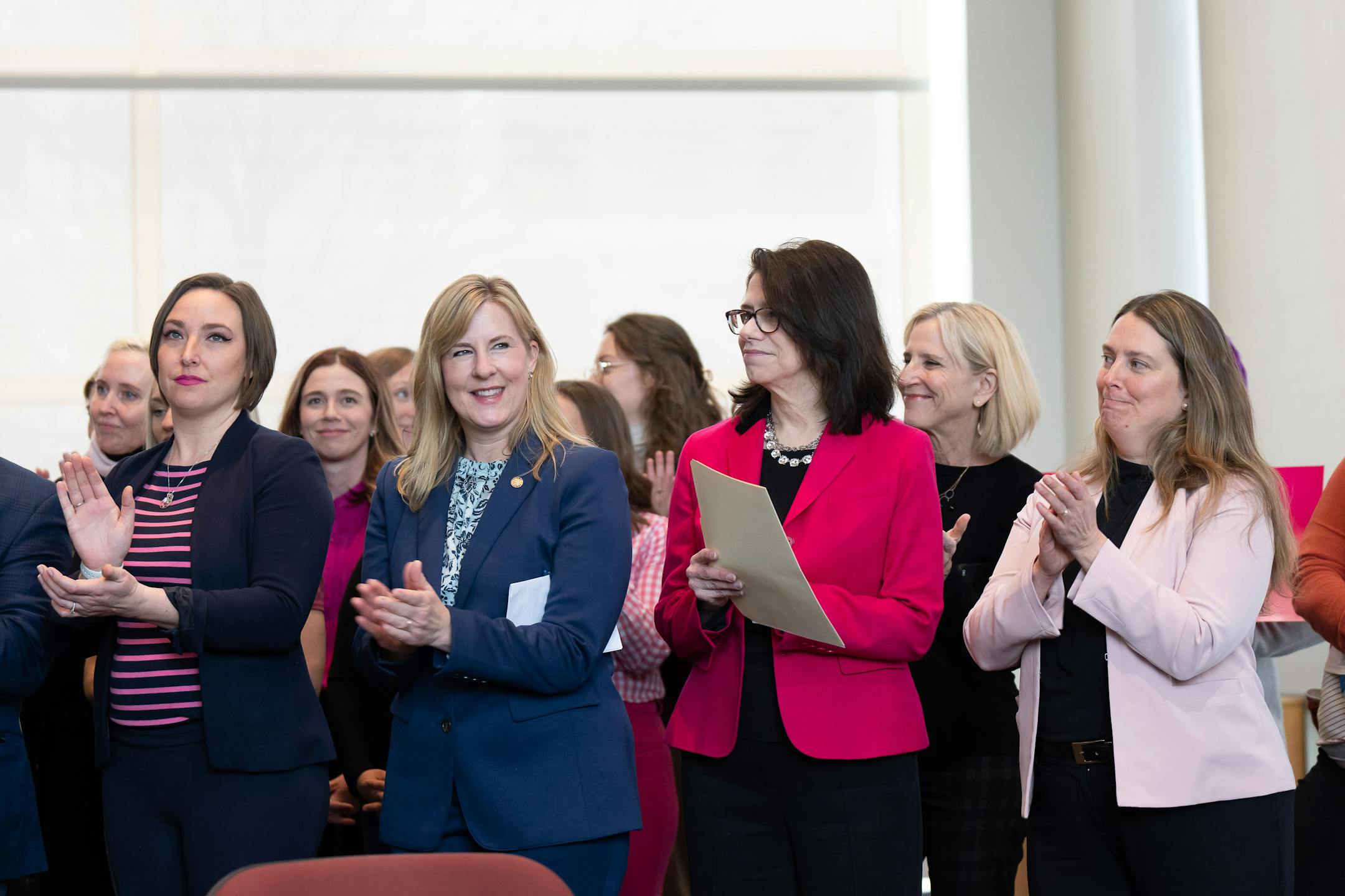 Legislators Rep. Carlie Kotyza-Witthuhn, DFL-Eden Prairie. House Speaker Melissa Hortman, DFL-Brooklyn Park, Senate Majority Leader Kari Dziedzic, DFL-Minneapolis and Sen. Jennifer McEwen, DFL-Duluth, applauded after Gov Walz pointed out that this was the first time women held both seats of power in the legislature.