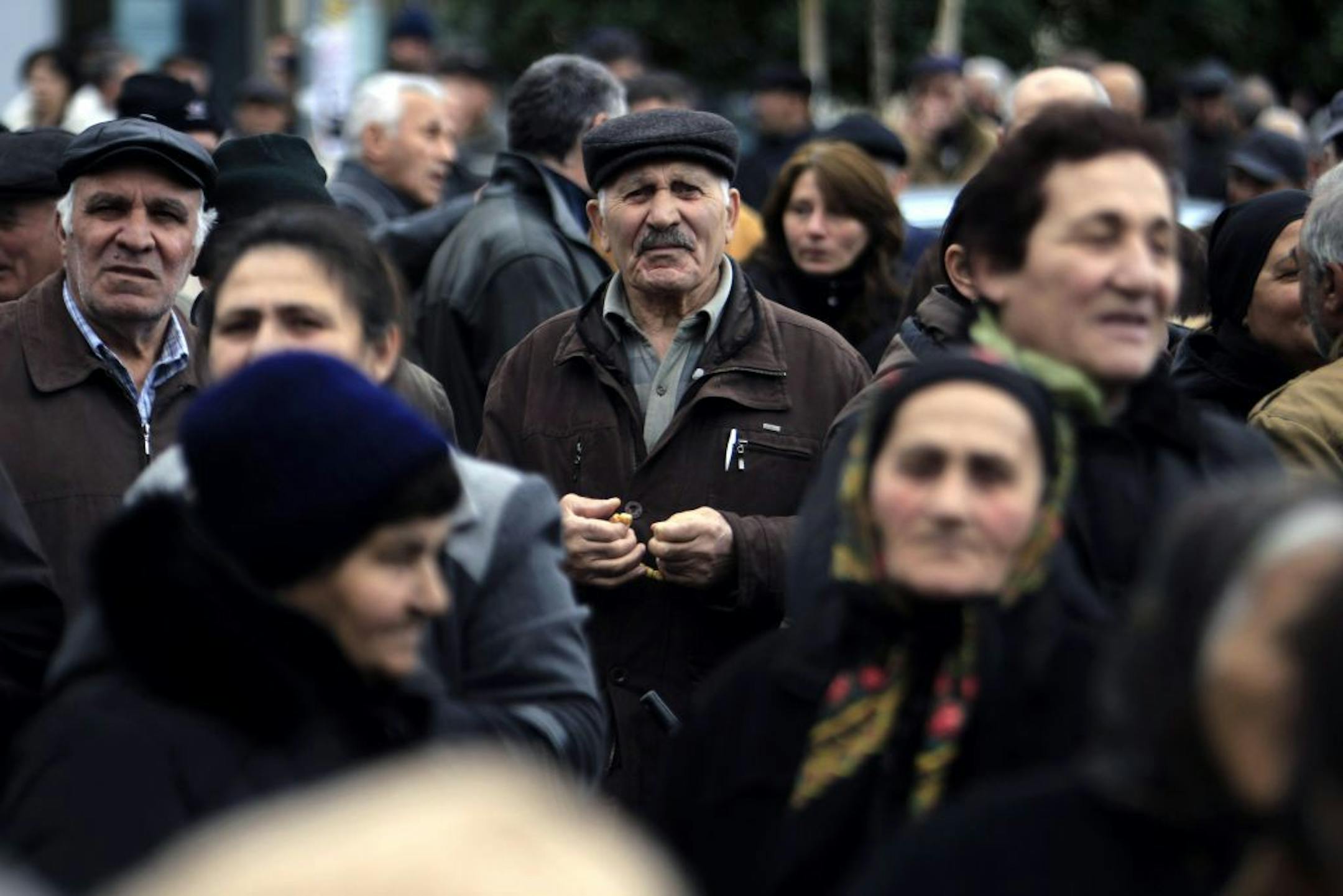 Elderly Greeks who once received small pensions from the farmers' fund despite having made insufficient social security contributions protest against the stopping of their pensions outside a government building in the northern port city of Thessaloniki, Greece, Wednesday, Feb. 13, 2013. About 1,500 people took part in the peaceful protest. The Greek government has slashed salaries and pensions while repeatedly hiking taxes over the past three years, as part of a massive savings drive demanded in