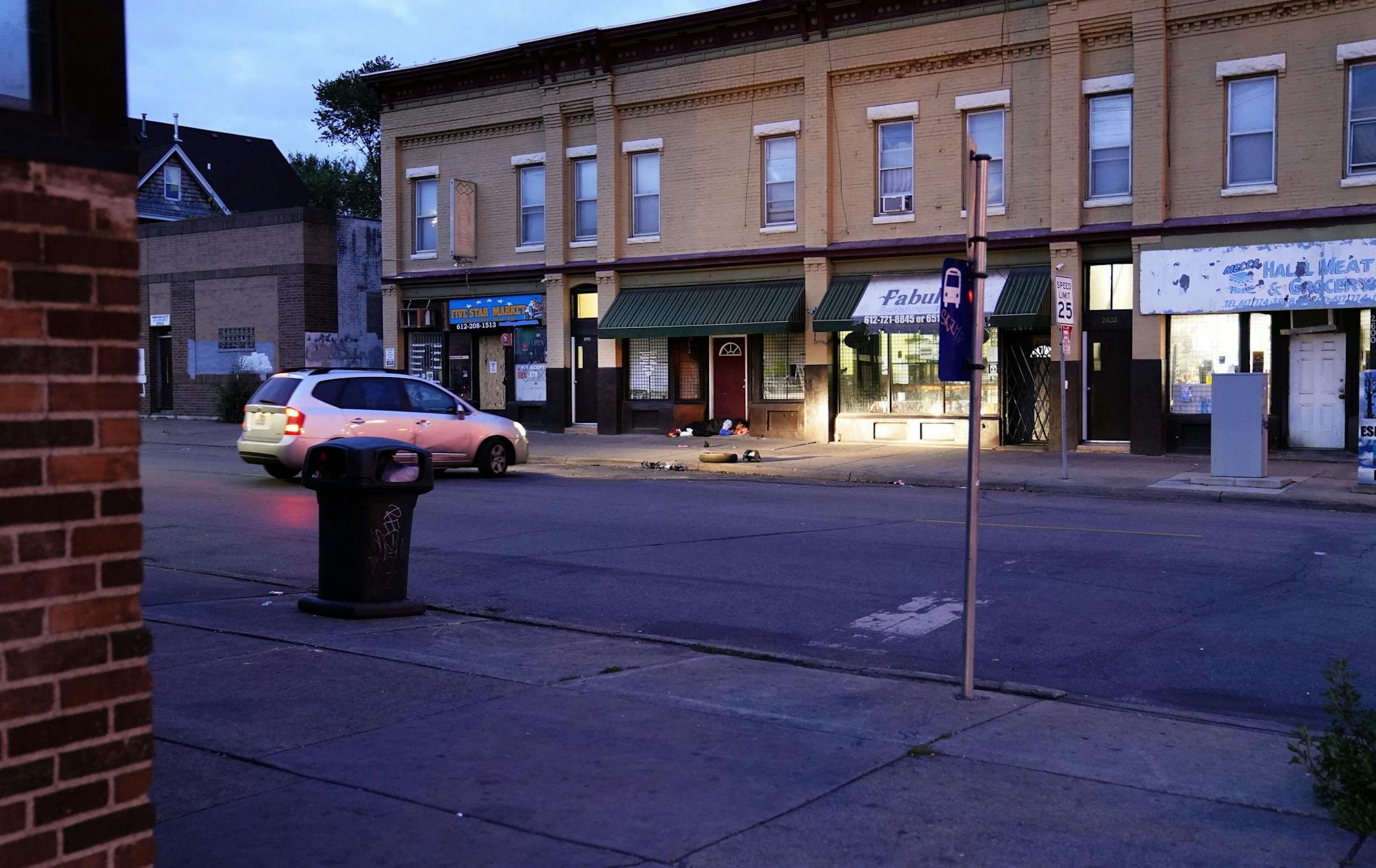 One person was killed in an overnight shooting near the intersection of 26th and Bloomington and seen Friday morning in Minneapolis. No one has been arrested for the shooting. Here, a person slept in business doorway near the intersection.