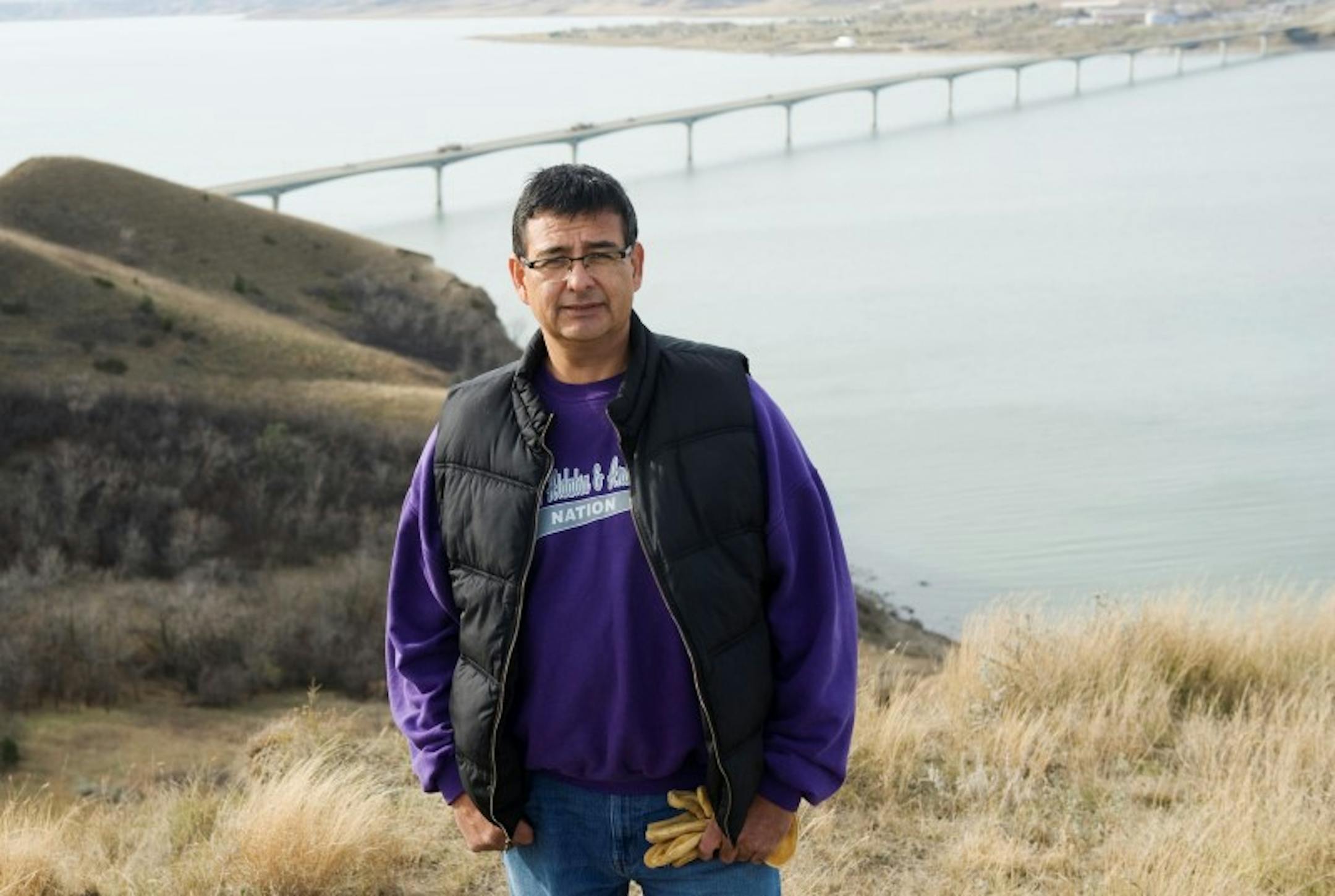Three Affiliated Tribes council chairman candidate Mark Fox poses at Crow Flies High Butte above the Missouri River before erecting campaign signs around the Fort Berthold Reservation in North Dakota, November 1, 2014. REUTERS/Andrew Cullen