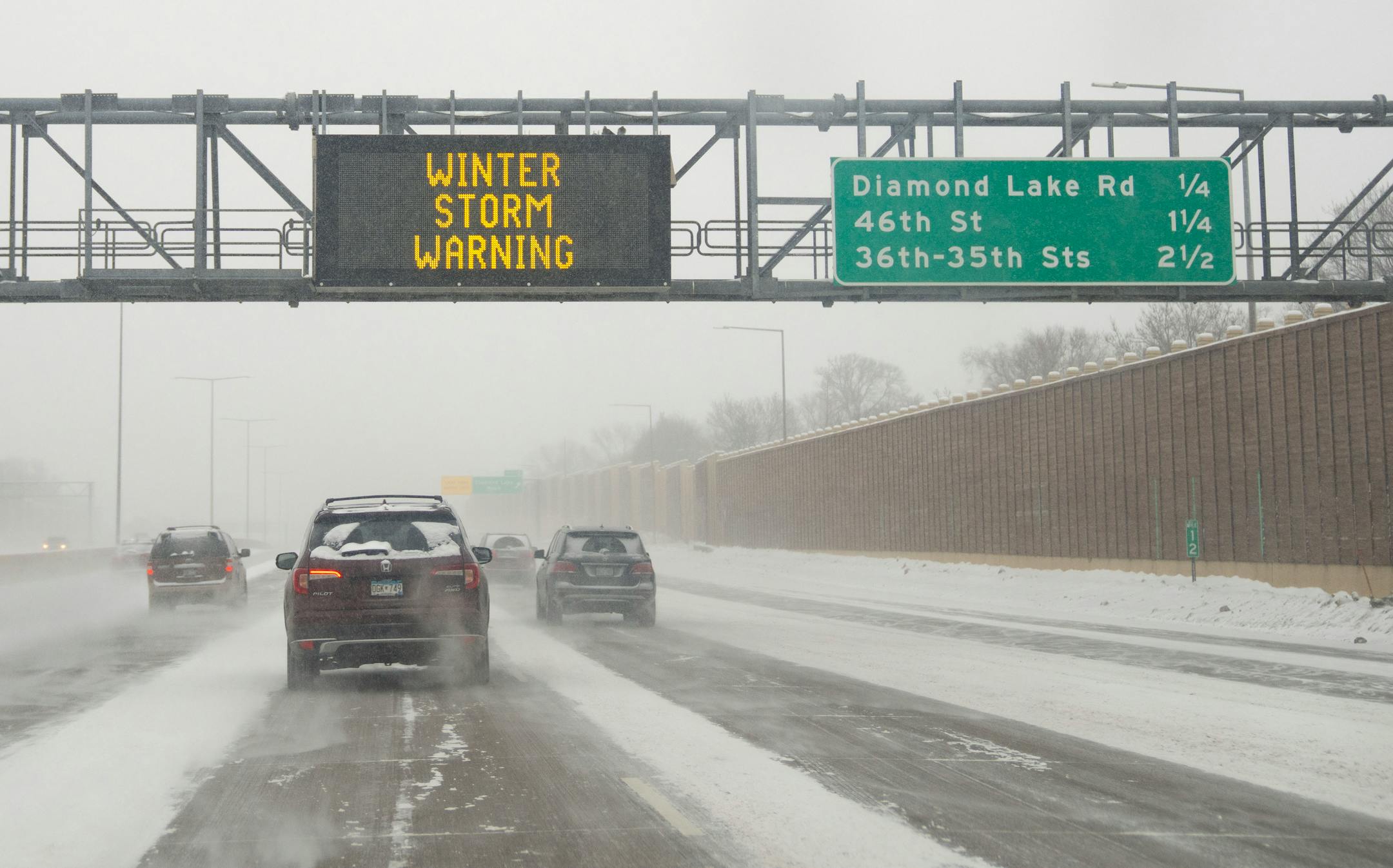 A sign on I-35 warns motorists of the incoming winter storm in Minneapolis.