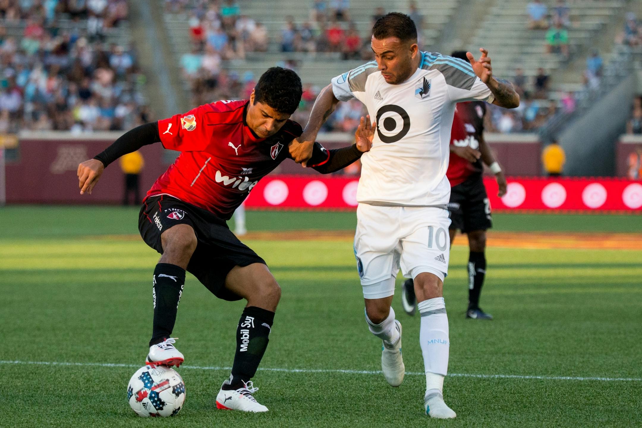 Atlas� Luis Robles maintains control over the ball against Minnesota United�s Miguel Ibarra during the first half on Saturday, July 15, 2017, at TCF Bank Stadium.