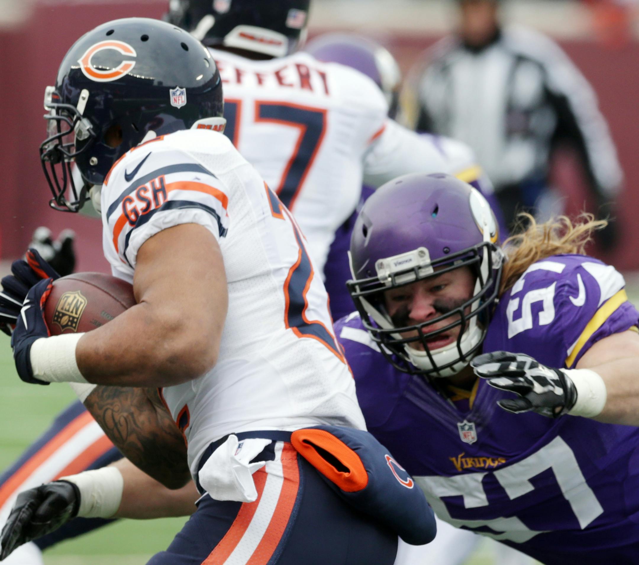 Minnesota Vikings middle linebacker Audie Cole, right, tackles Chicago Bears running back Matt Forte during the first half of an NFL football game, Sunday, Dec. 28, 2014, in Minneapolis. (AP Photo/Jim Mone) ORG XMIT: MNCN1