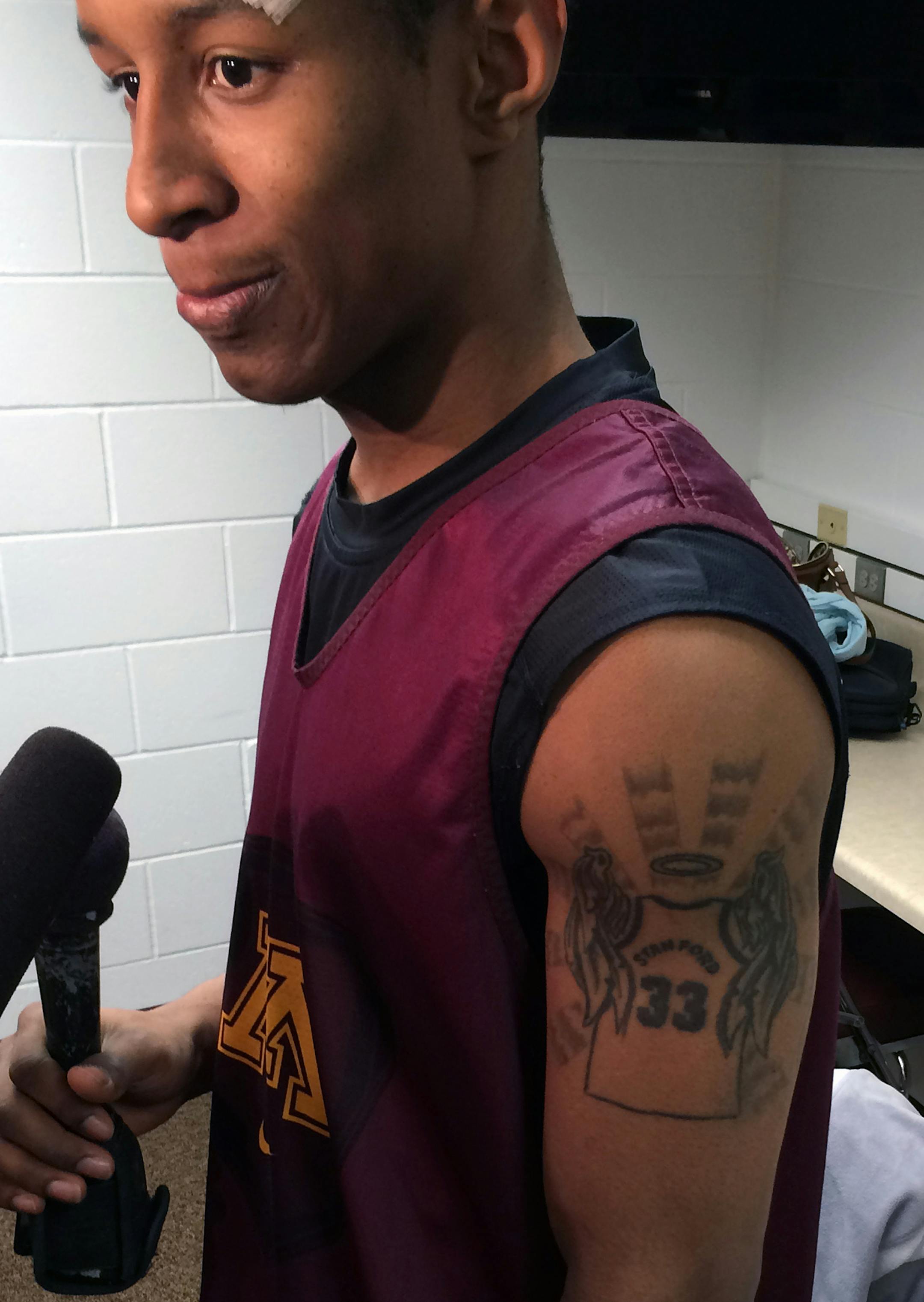 Gophers basketball DeAndre Mathieu‚Äôs on his left arm, a tattoo of a basketball jersey, the number 33 with Stanford‚Äôs name. Angels wings on the side, a halo on top. Boyhood friend from Knoxville who took his own life after a series of tragedies.
