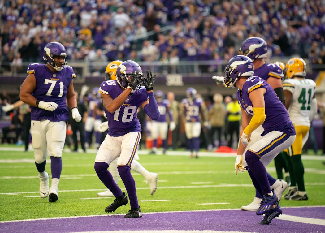 Vikings receivers Justin Jefferson (18) and Adam Thielen dance in the end zone to celebrate Jefferson’s third-quarter touchdown.