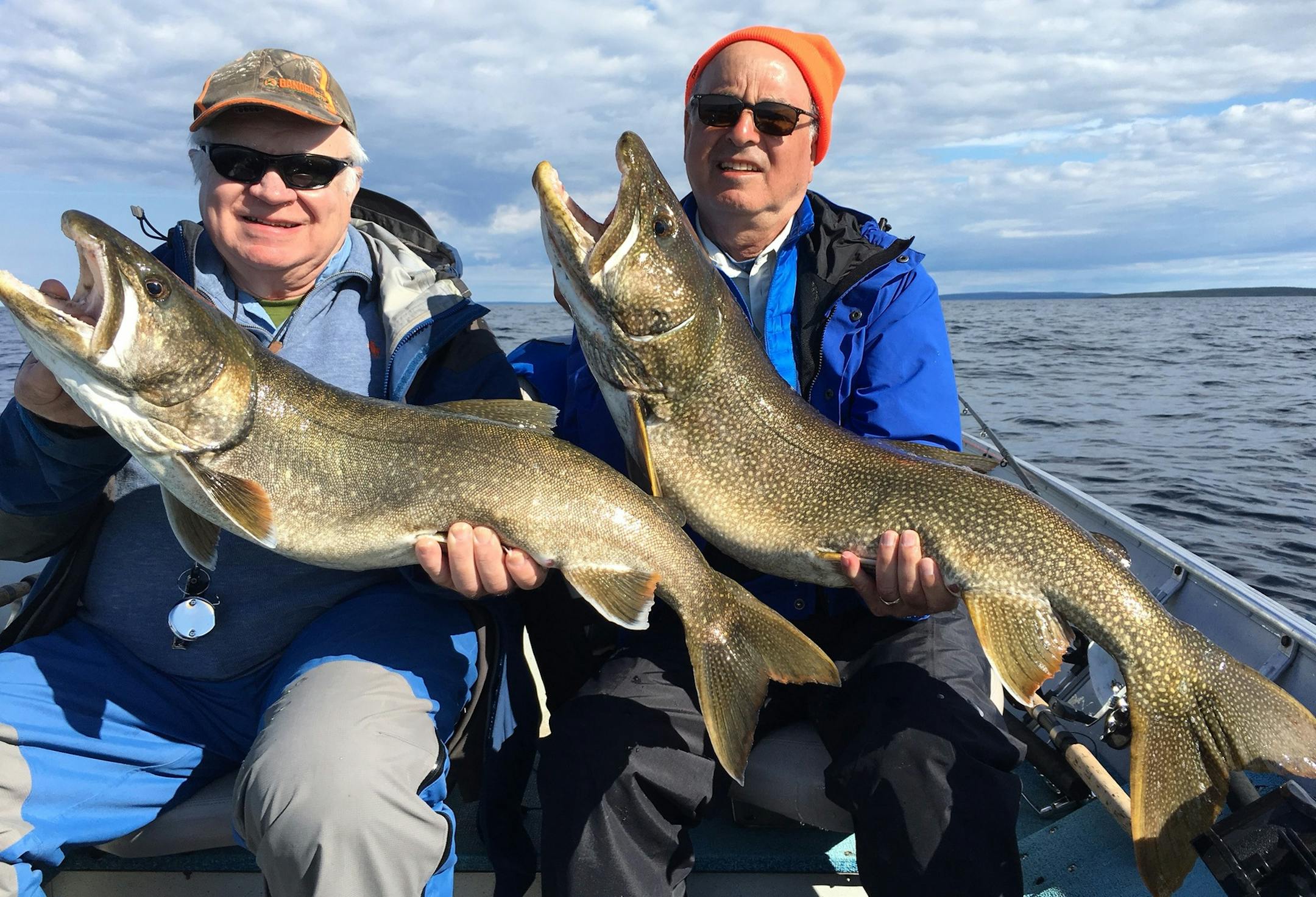 While fishing on Kasba Lake of Canadaís Northwest Territories, Ron Peterson, of Edina, and Manny Gaziano, of Minneapolis, doubled their pleasure. As Peterson (left) had 14-pound lake trout on line, Gaziano reeled in to get out of Petersonís way. As he did, he hooked a 17-pound lake trout. Each was released.