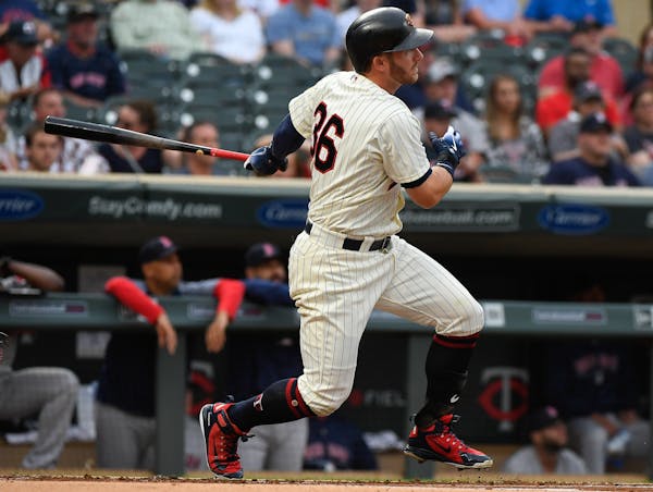 Minnesota Twins designated hitter Robbie Grossman (36) followed through with his swing after hitting a lead off home run in the bottom of the first in