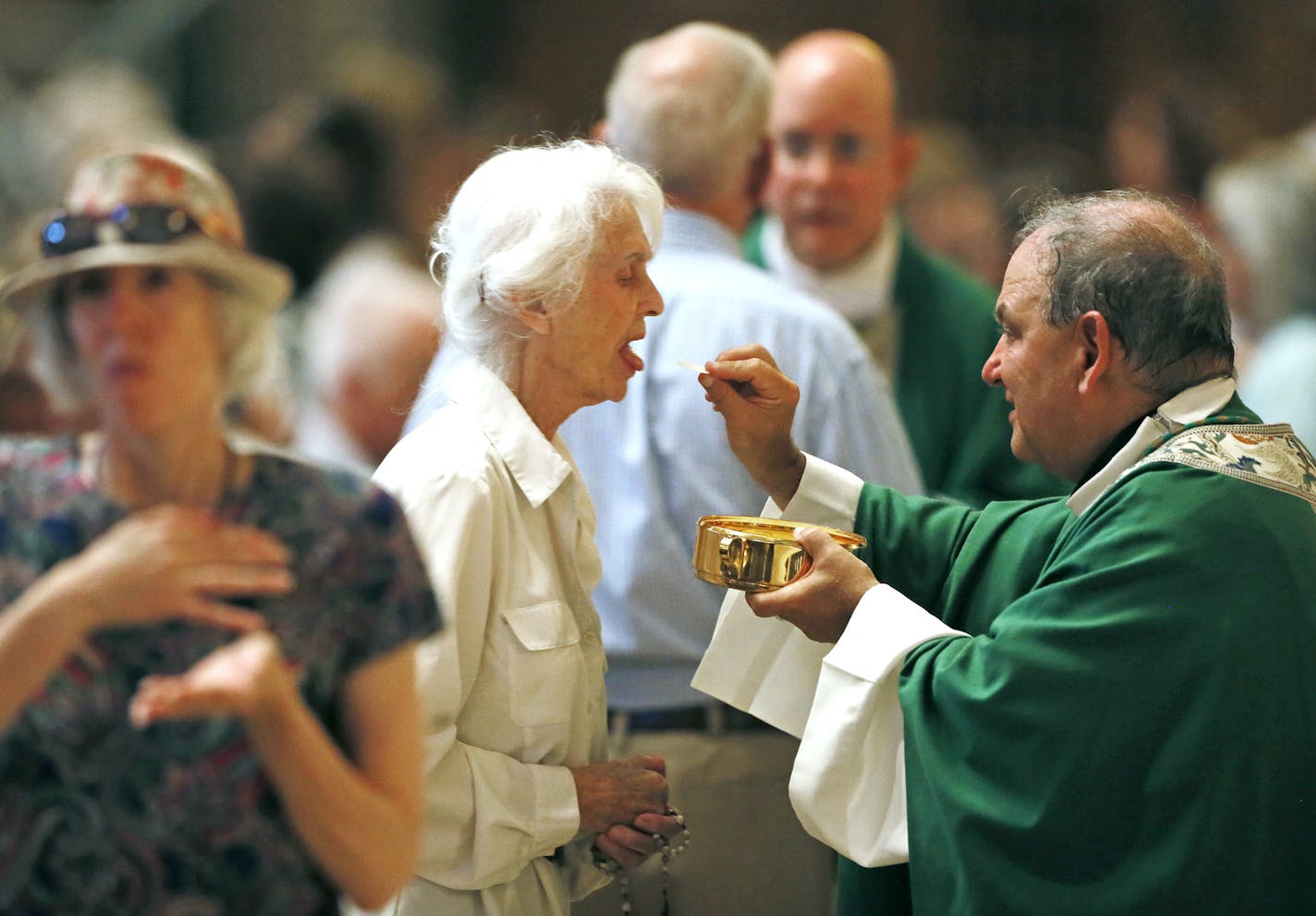 Archbishop Bernard Hebda gave Communion to parishioners during his first mass at the St. Paul Cathedral Sunday July 12, 2015 in St. Paul MN. ] Jerry Holt/ Jerry.Holt@Startribune.com