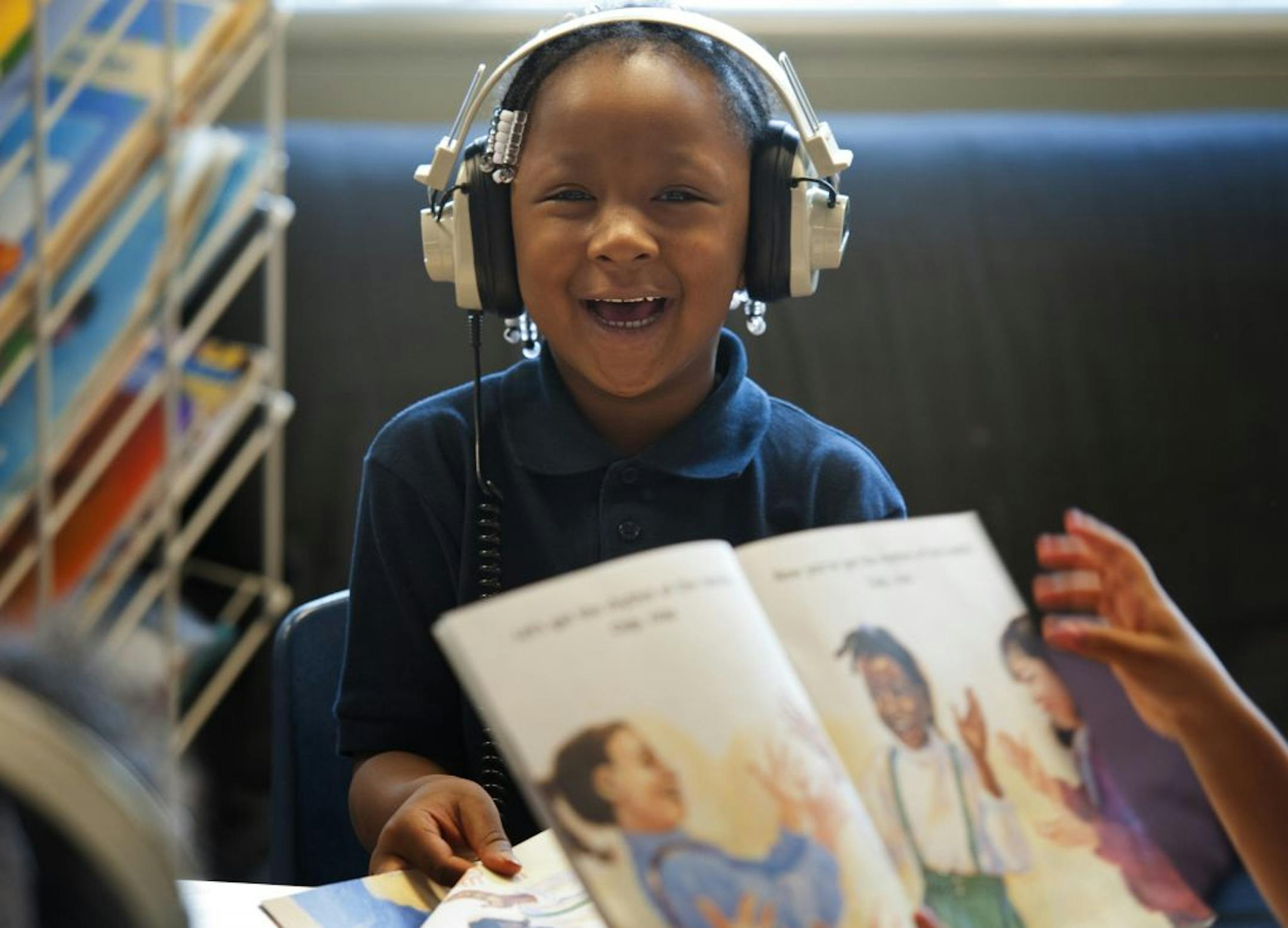 Kindergartner Zoreya Sellers listened and laughed at "Let's Get The Rhythm" in her all-day class in St. Paul.