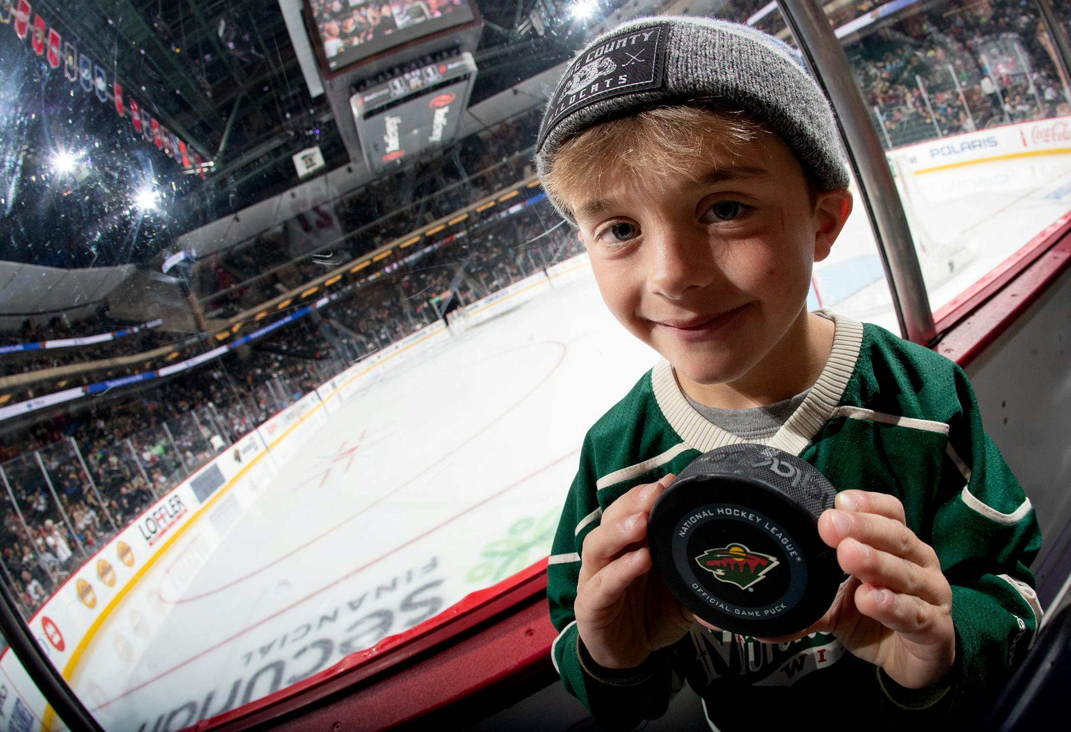 Chase Ryner, 7, of Dodge Center got an errant puck while sitting on the glass during the Minnesota Wild vs. Winnipeg Jets game at Xcel Energy Center. ] CARLOS GONZALEZ • cgonzalez@startribune.com – St. Paul, MN – September 29, 2019, Xcel Energy Center, NHL Pre Season Hockey, Minnesota Wild vs. Winnipeg Jets