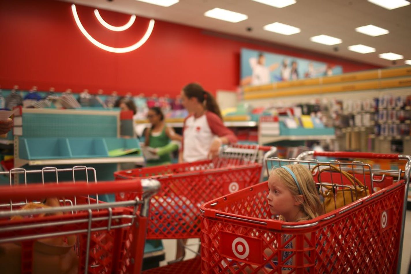 Grace Carlson, 6, waited her turn while her mom, Ann, and sister, Claire, 11, shopped for school supplies at a Target store in Edina.