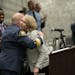 St. Paul Police Chief Todd Axtell hugged Angie Steenberg as she accepted the award of Civilian of the Year in St. Paul, Minn., on Monday, April 22, 20