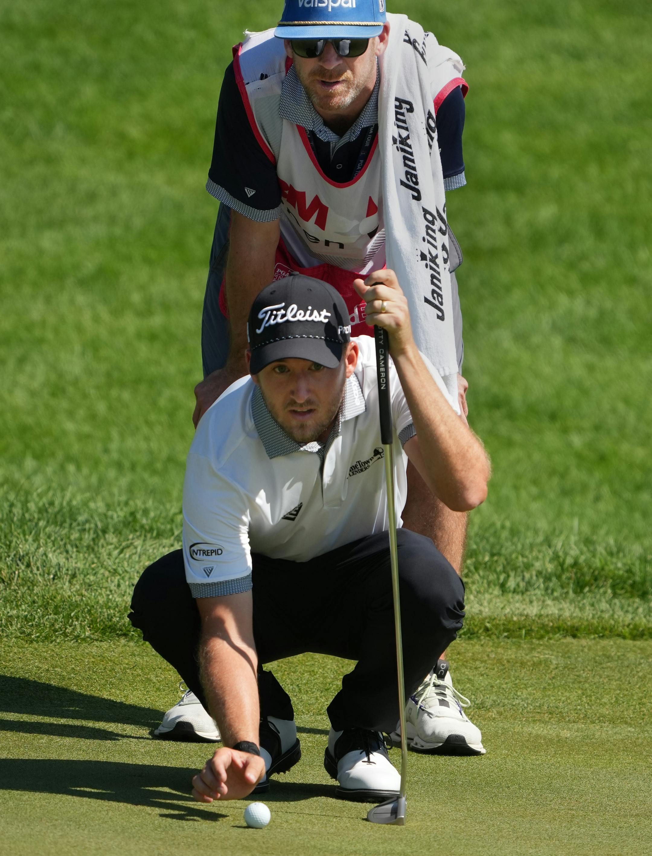 Lee Hodges lined up a put with his caddy during the final round of the 3M Open Sunday.