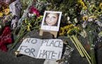 FILE &#xf3; A memorial for Heather Heyer at the scene where she was killed when a man drove into a crowd during a protest against a rally of white nat