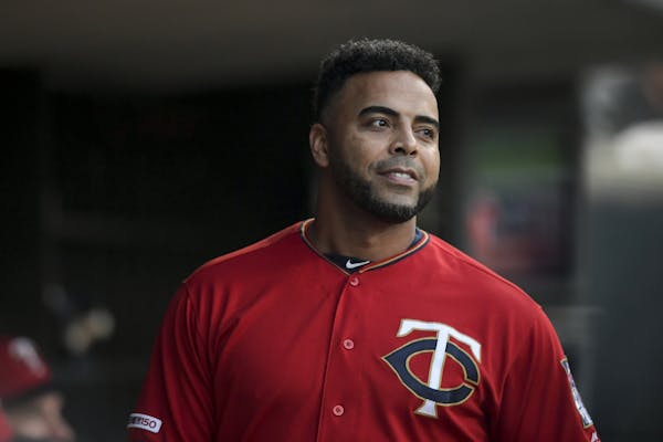 Minnesota Twins designated hitter Nelson Cruz (23) walked the dugout before Friday night's game against the Kansas City Royals.