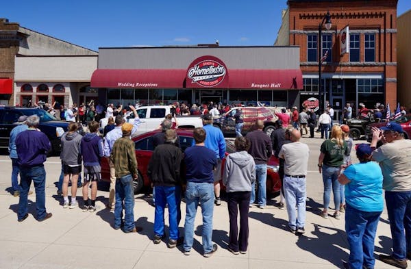 Crowds gathered outside Shady's Hometown Tavern in Albany, Minn. on Monday but the tavern did not reopen.