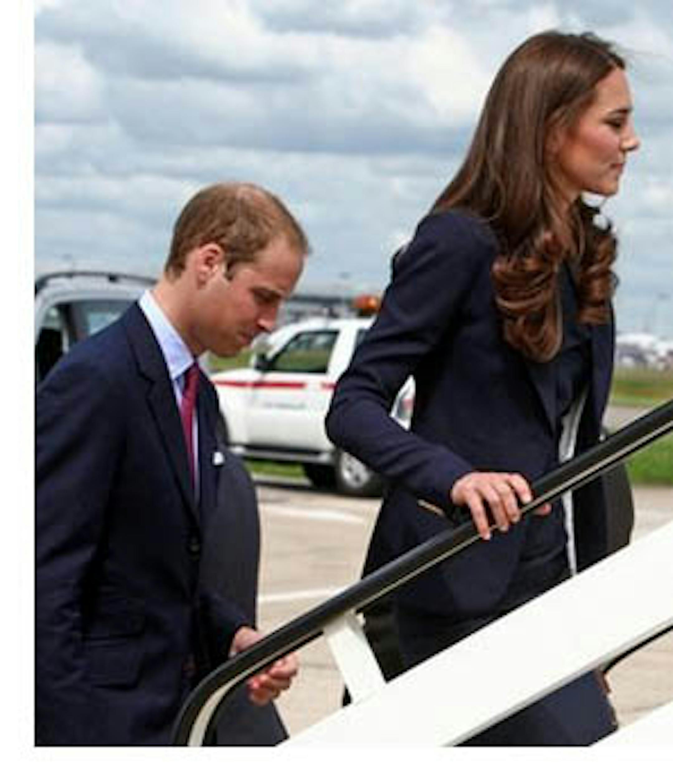 The Duke and Duchess of Cambridge board a plane of the Royal Canadian Air Force at London's Heathrow Airport, Thursday June 30, to travel to Ottawa for their first overseas tour as a married couple. The 11 day tour will take them to Canada and then on to California.(AP Photo/Steve Parsons, pool)