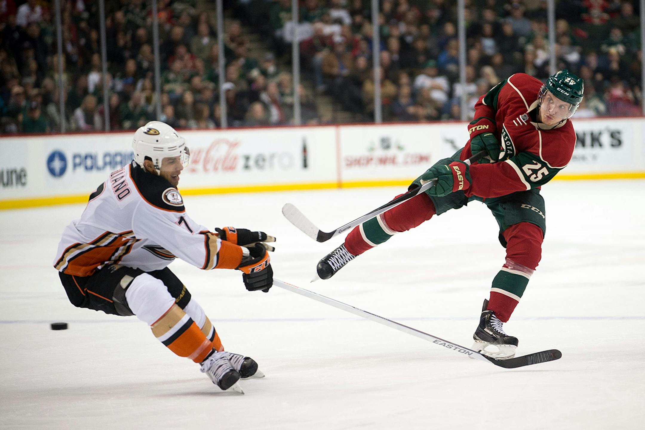 Minnesota Wild defenseman Jonas Brodin (25) shoots a game-tying goal past Anaheim Ducks center Andrew Cogliano (7) in the third period. ] AARON LAVINSKY • aaron.lavinsky@startribune.com The Minnesota Wild take on the Anaheim Ducks Friday, Dec. 5, 2014 at Xcel Energy Center in St. Paul.