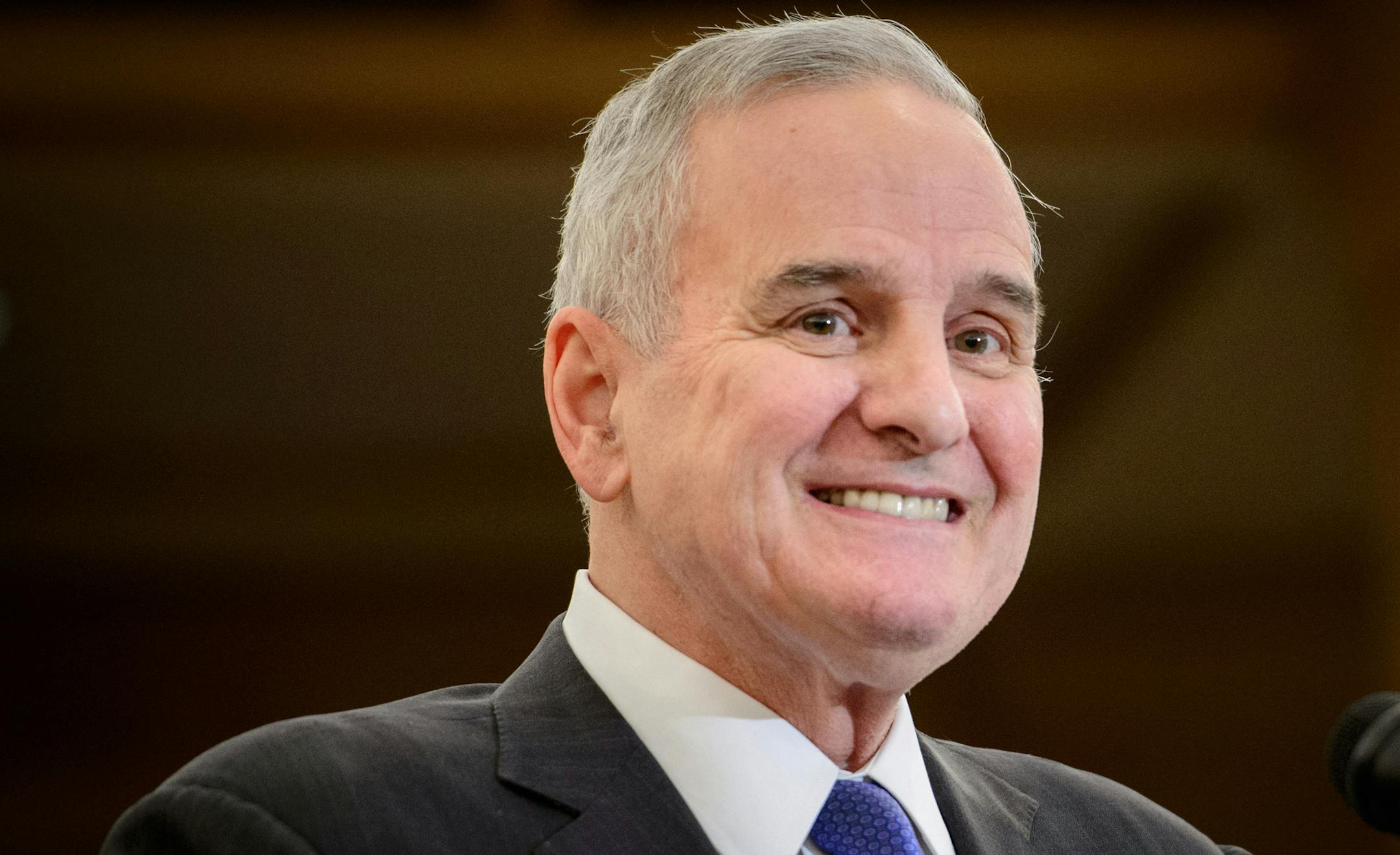 Governor Dayton smiled as he entered the press conference to talk about the budget surplus. ] GLEN STUBBE * gstubbe@startribune.com Friday, February 27, 2015 Minnesota Management and Budget Office officials, Commissioner Myron Frans, State Economist Laura Kalambokidis and State Budget Director Margaret Kelly reported that Minnesota's projected budget surplus grew to $1.9 billion, up $832 million from a previous projection.
