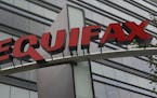 This Saturday, July 21, 2012, photo shows signage at the corporate headquarters of Equifax Inc. in Atlanta. Equifax said Thursday that problems with a