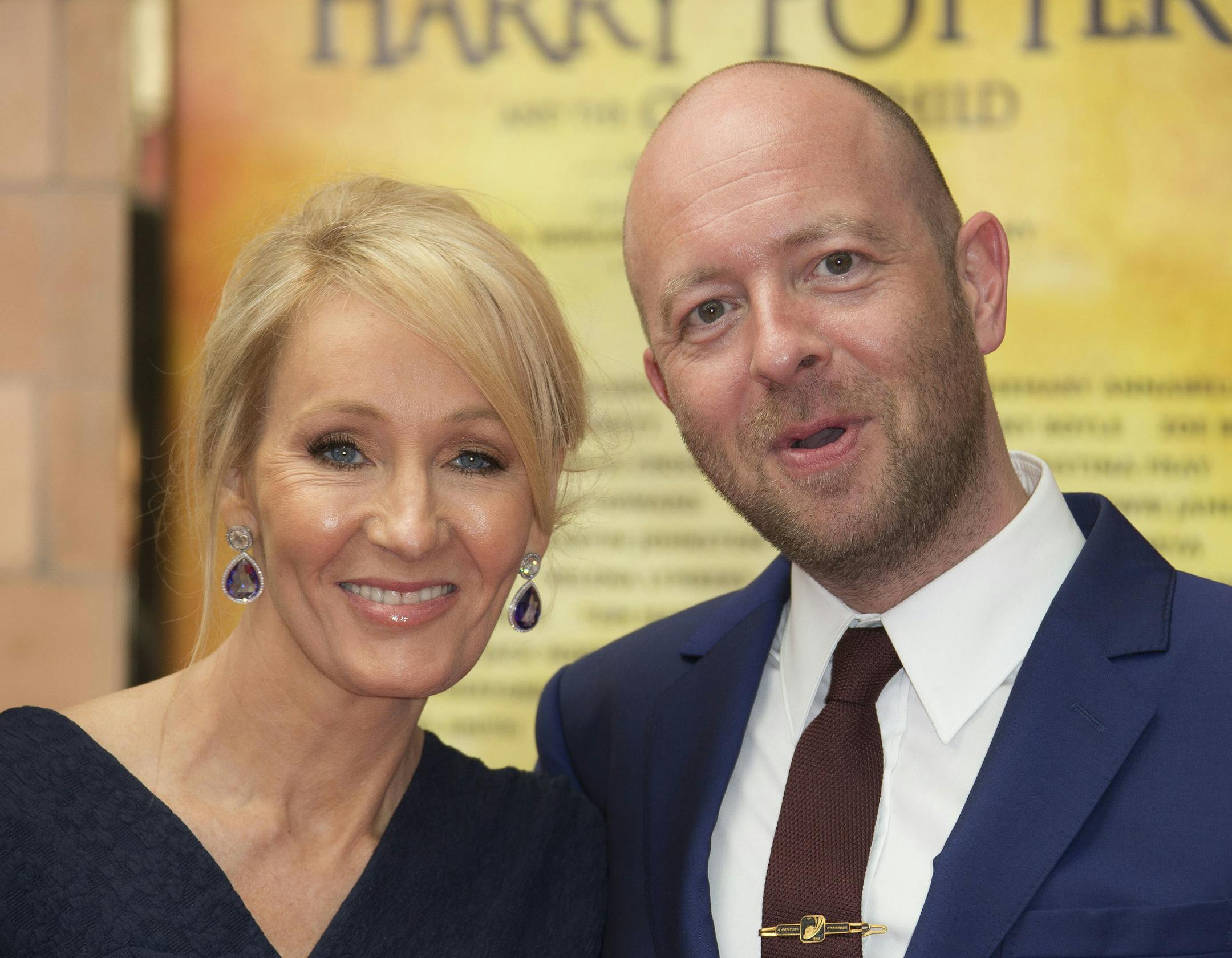 Writer J.K. Rowling, left and Director John Tiffany pose for photographers upon arrival at gala performance of Harry Potter and the Cursed Child, at the Palace Theatre in central London, Saturday, July 30, 2016. Based on an original new story by J.K. Rowling, John Tiffany and Jack Thorne, it is the eighth story in the Harry Potter series and is the first of the stories to be presented on stage. (Photo by Joel Ryan/Invision/AP)