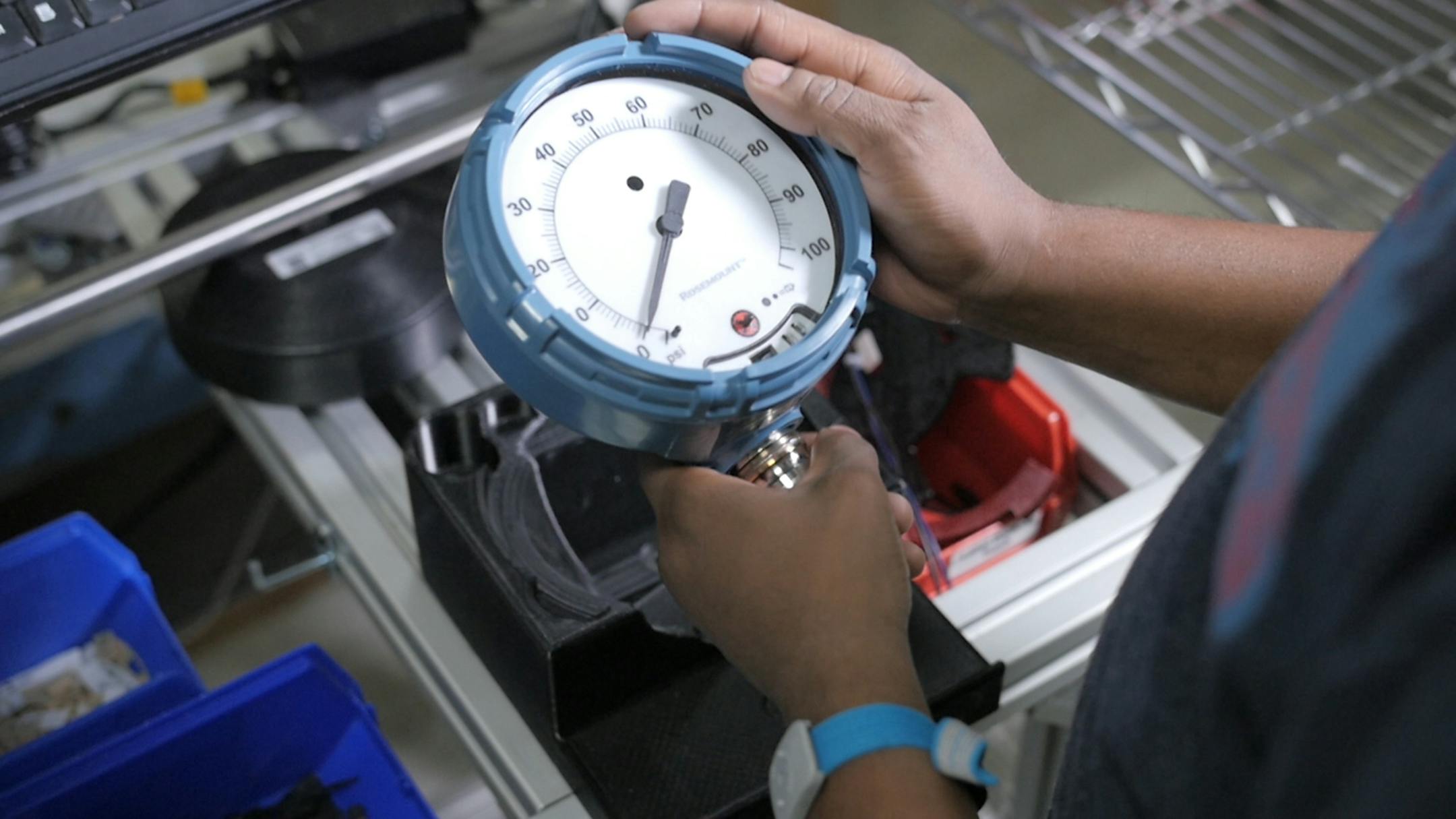 Employee making an Emerson Rosemount Wireless Pressure Gauge in Chanhassen, Minn. The product helps oil and gas producers improve operations by remotely delivering reliable readings of changes in the field. Economics expect the oil industry to rebound in 2017, prompting a rise in supply orders for products such as this.