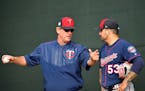 Twins pitching coach Neil Allen talked to pitcher Hector Santiago during a bullpen session Thursday.