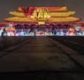 Colored lights play across the Gate of Heavenly Purity is bathed in light at the Forbidden City in Beijing on Tuesday night, Feb. 19, 2019. For the fi