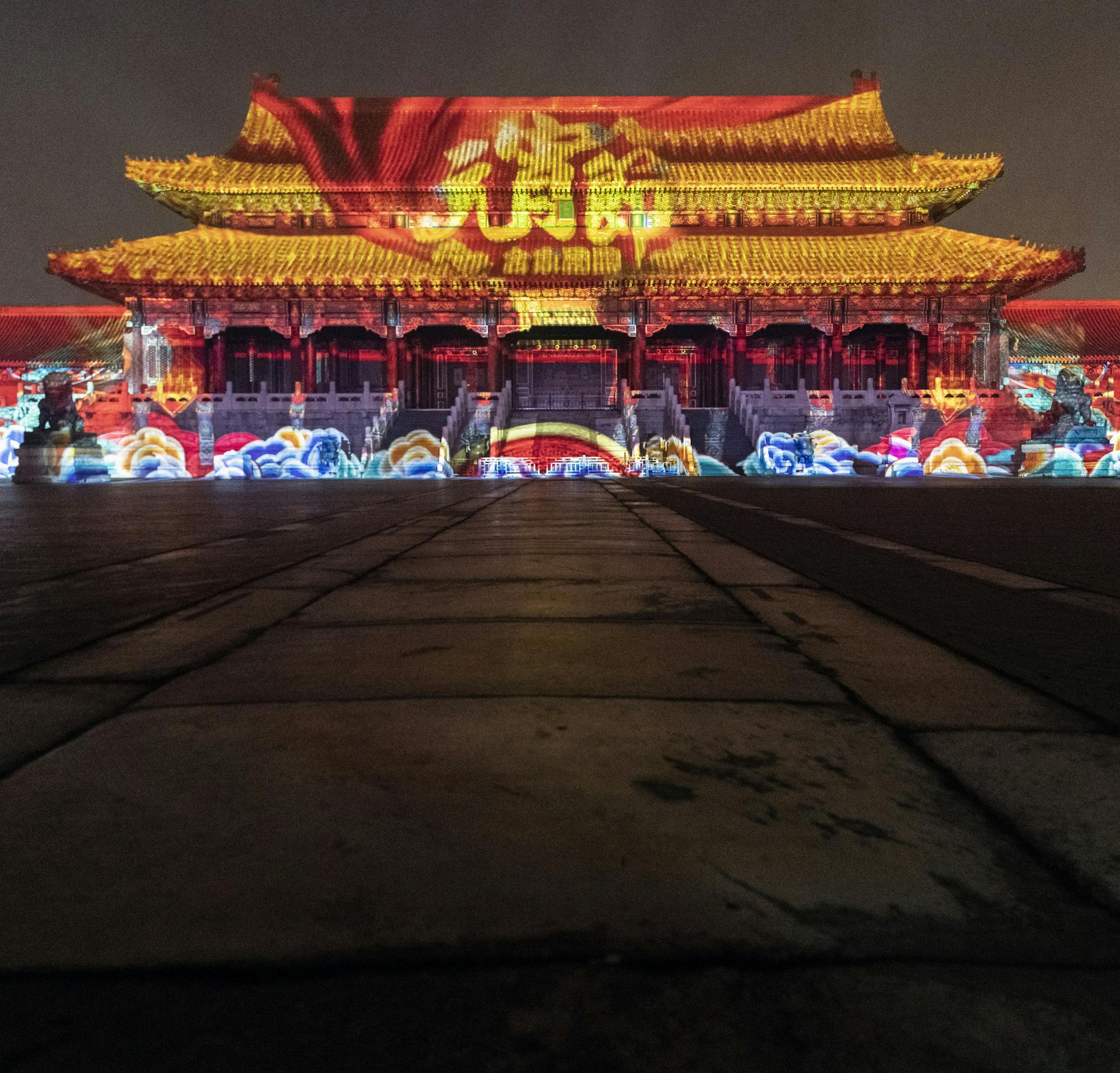 Colored lights play across the Gate of Heavenly Purity is bathed in light at the Forbidden City in Beijing on Tuesday night, Feb. 19, 2019. For the first time since 1925, when the former home of the emperors of the Ming and Qing dynasties became a museum, the Forbidden City has opened its doors to the public at night for two days this week, allowing visitors the chance to see its palaces and temples bathed in ethereal lights. (Gilles Sabrié/The New York Times)