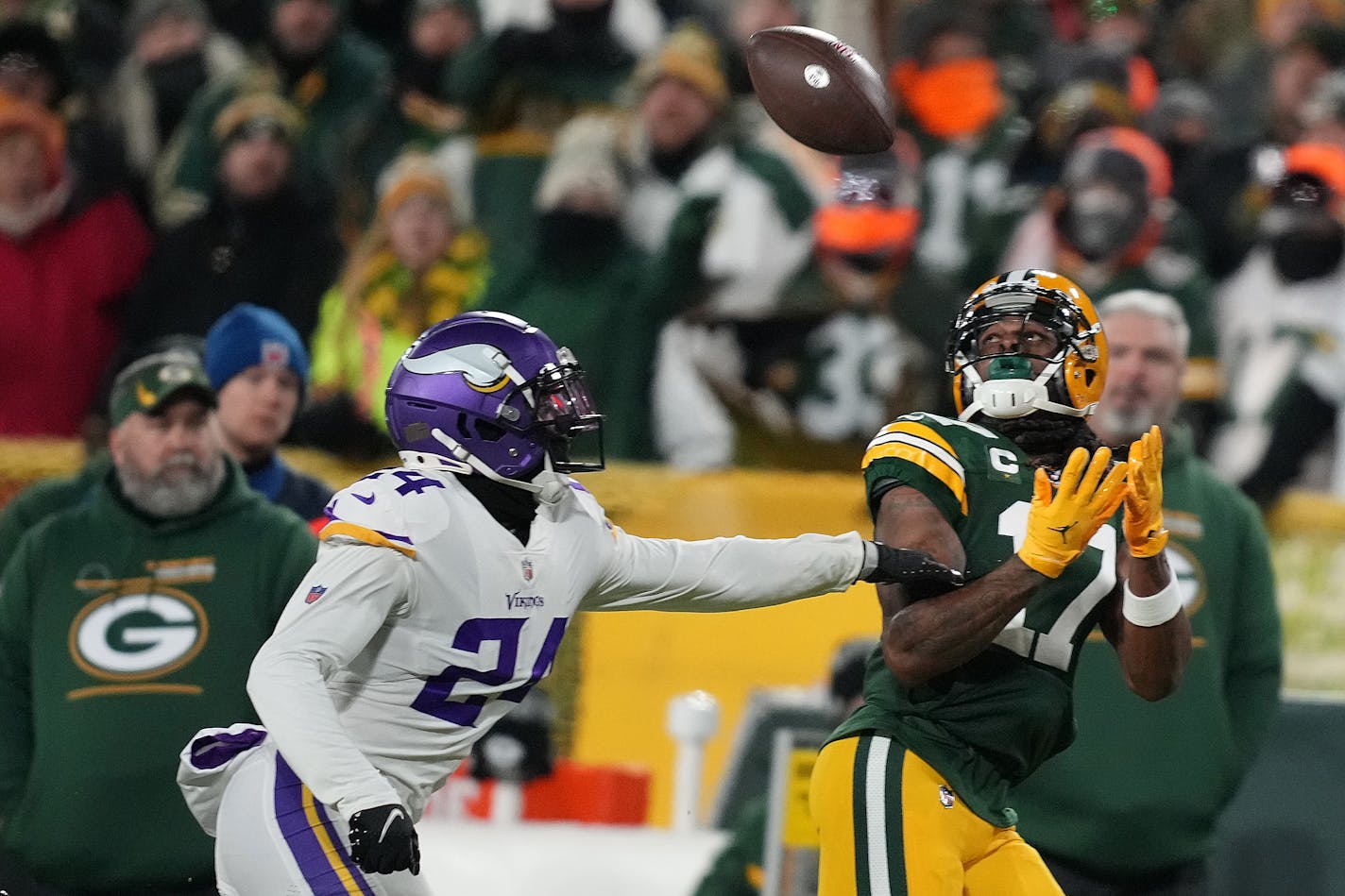 Green Bay Packers wide receiver Davante Adams (17) caught a long pass from quarterback Aaron Rodgers (12) as Minnesota Vikings cornerback Mackensie Alexander (24) raced to defend in the first quarter of an NFL game between the Minnesota Vikings and the Green Bay Packers Sunday, Jan. 2, 2022 at Lambeau Field in Green Bay, Wis. ] ANTHONY SOUFFLE • anthony.souffle@startribune.com