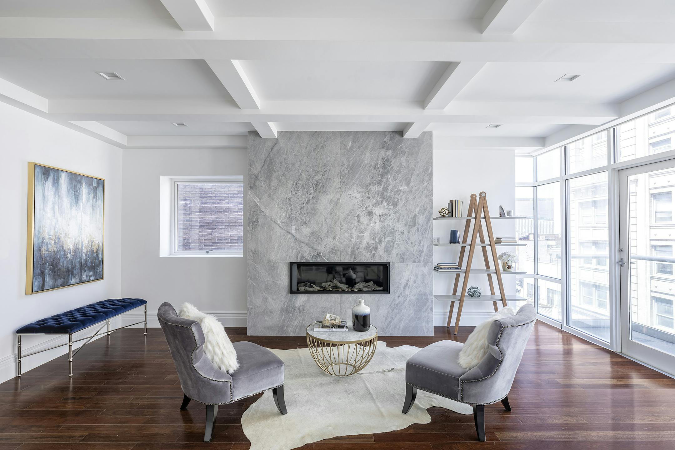 A separate seating area around or near a fireplace can serve as a cozy addition to a space. (Design Recipes)