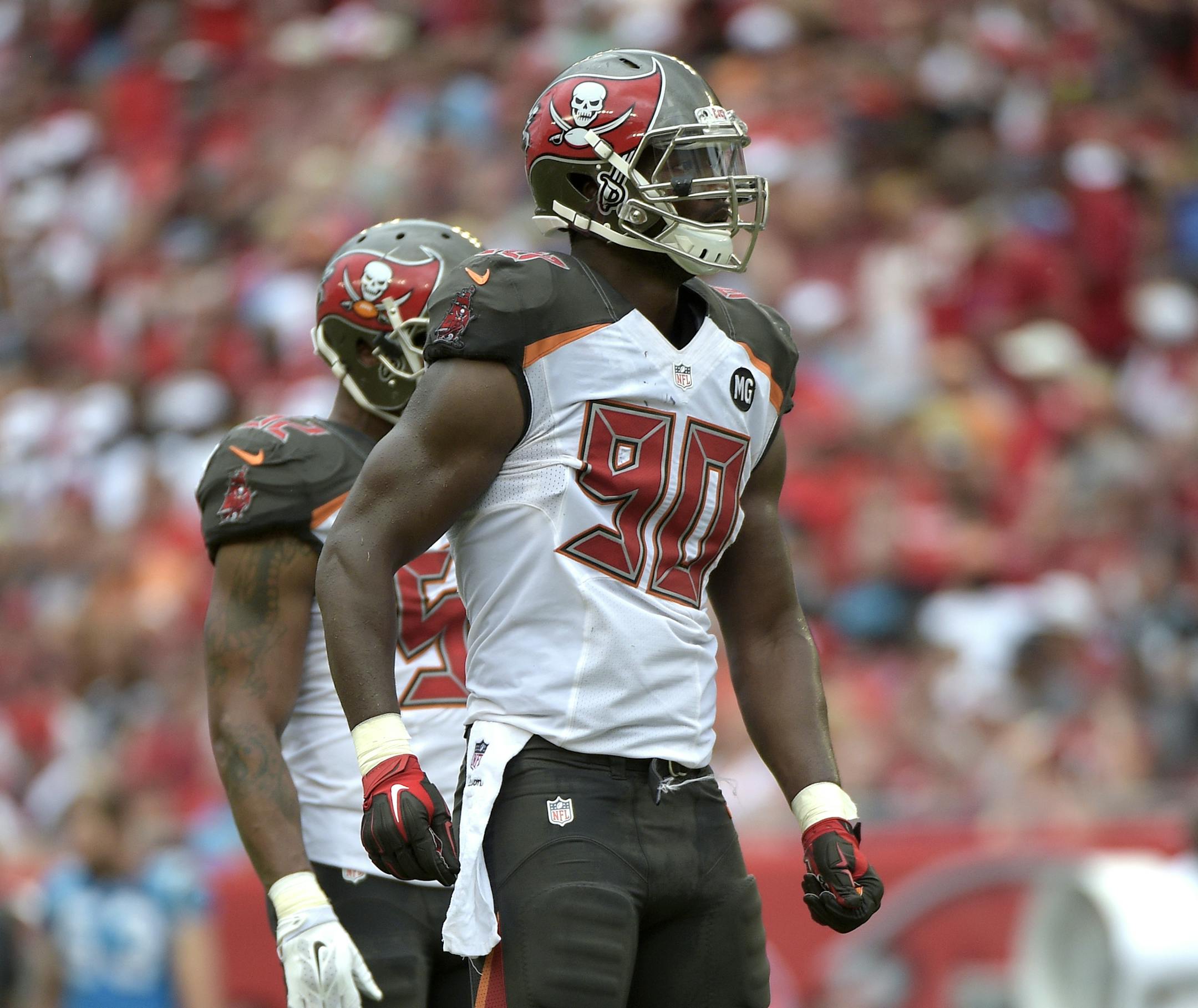 Tampa Bay Buccaneers defensive end Michael Johnson (90) waits for a play at the line of scrimmage during the second half of an NFL football game against the Carolina Panthers in Tampa, Fla., Sunday, Sept. 7, 2014.(AP Photo/Phelan M. Ebenhack) ORG XMIT: OTKPANT310