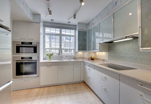 The homeowners remodeled the kitchen with German Leicht cabinets and Miele stainless-steel appliances.