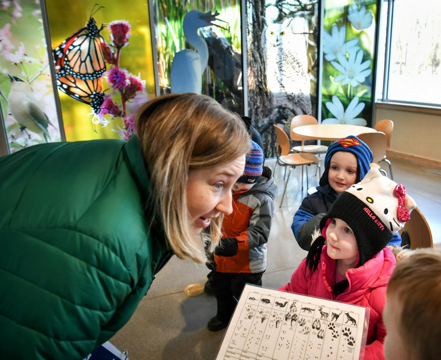 Tara Rogness, program coordinator at Springbrook Nature Center got her group excited about going outside to find animal tracks in the snow. ] GLEN STUBBE &#x2022; glen.stubbe@startribune.com Tuesday, January 9, 2018 Springbrook Nature Center, Fridley's biggest park that attracts about 150,000 visitors annually, just passed its first full year in an expanded interpretative center, made possible by $5 million in state bonding. The small town park with a big draw is still plenty busy with projects