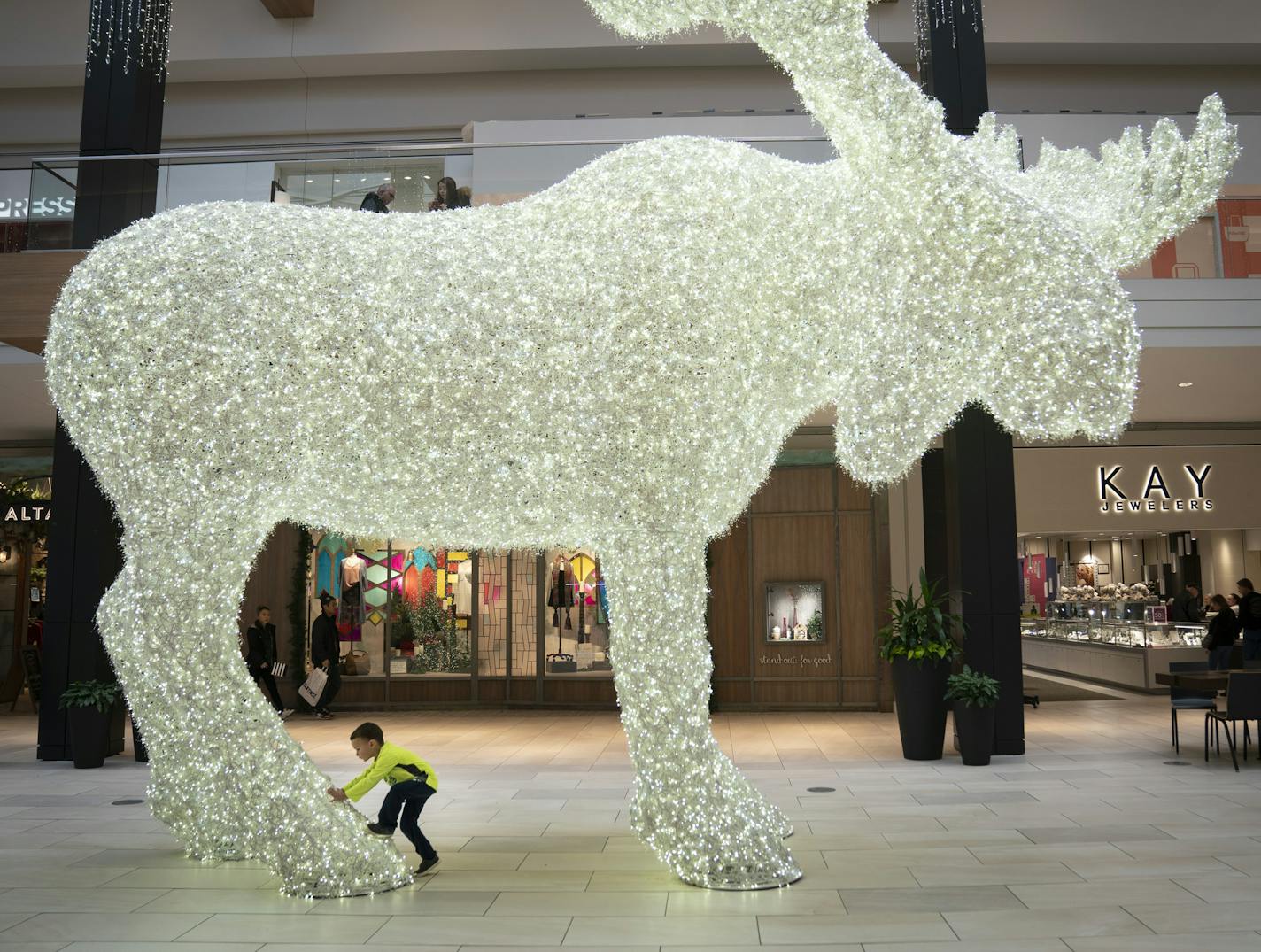 Johnathan Corcoran (CQ), 4, walked under a large Moose made out of Christmas lights on display in the middle of Rosedale Center in Roseville, Minn., on Friday, December 20, 2019. ] RENEE JONES SCHNEIDER &#xa5; renee.jones@startribune.com