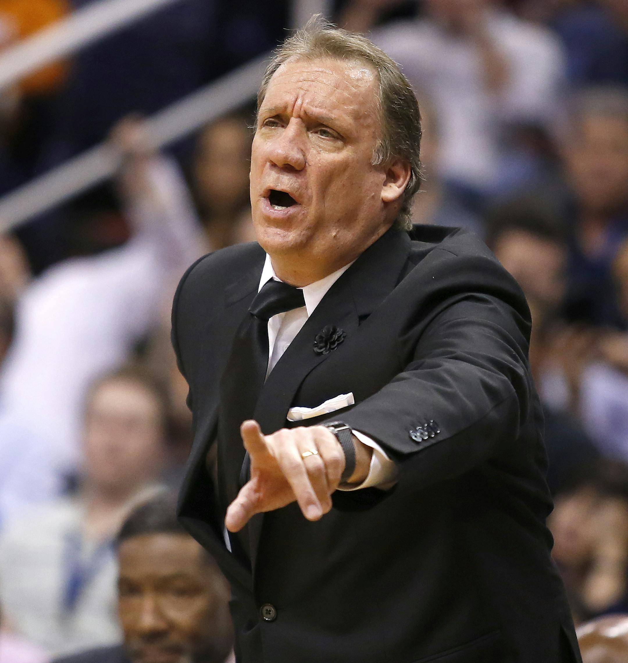 Minnesota Timberwolves coach Flip Saunders calls out a foul against the Phoenix Suns during the second quarter of an NBA basketball game, Wednesday, March 11, 2015, in Phoenix. (AP Photo/Rick Scuteri) ORG XMIT: MIN2015031323202477