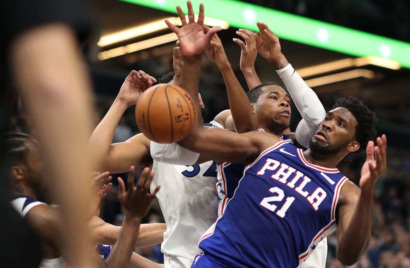 76ers center Joel Embiid (21) pulled down a defensive rebound in the second half against the Timberwolves on Tuesday night.